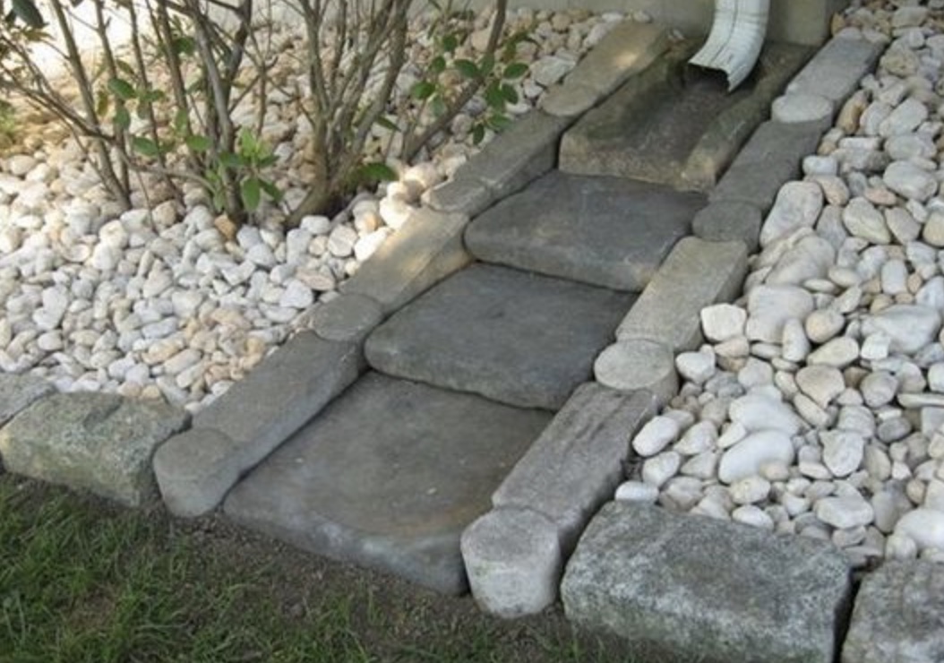 Downspout with rocks