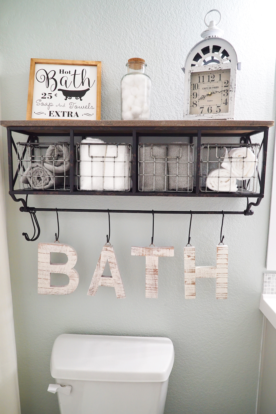 bathroom organization ideas shelf with hooks above toilet hello hayley