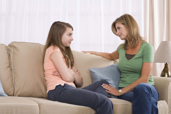 mother and teenage daughter talking