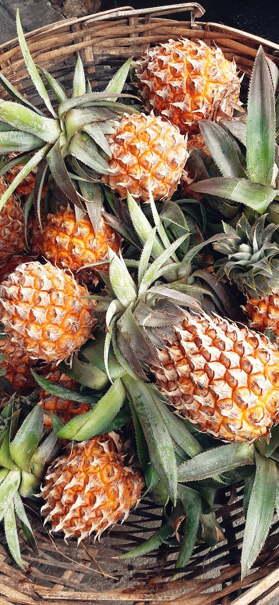 pineapples in basket